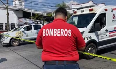 Bombero y ambulancia en zona acordonada por amenaza de bomba